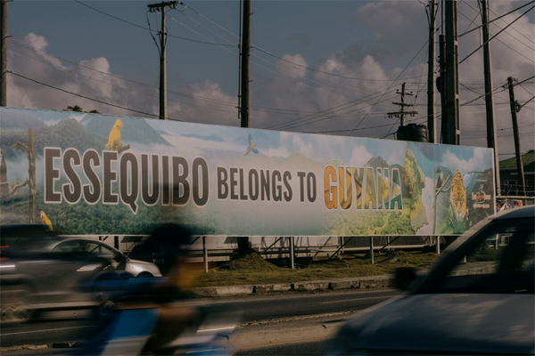 A sign that reads "Essiquibo Belongs to Guyana" displayed at the Madela Eccles roundabout in Georgetown, Guyana.Photographer: Jose A. Alvardo Jr./Bloomberg