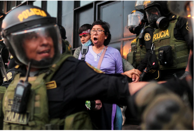 A woman takes part in a protest in Lima on Thursday.  