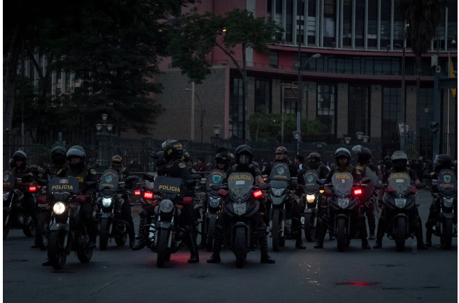 Riot police on motorcycles during protests in Lima on Thursday. 