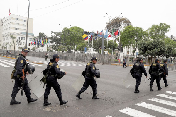 Police officers walk outside Peru's Congress after President Pedro Castillo said he will dissolve Congress as he battles impeachment proceedings, in Lima, Peru November 7, 2022. 