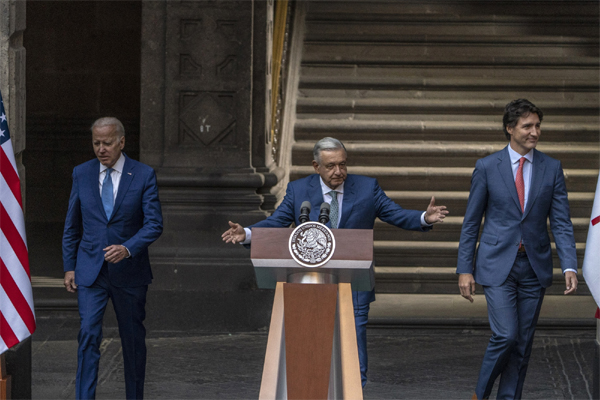 US President Joe Biden, Mexican President Andres Manuel Lopez Obrador and Canadian Prime Minister Justin Trudeau arrive for the North American Leaders’ Summit in Mexico City on Tuesday. 