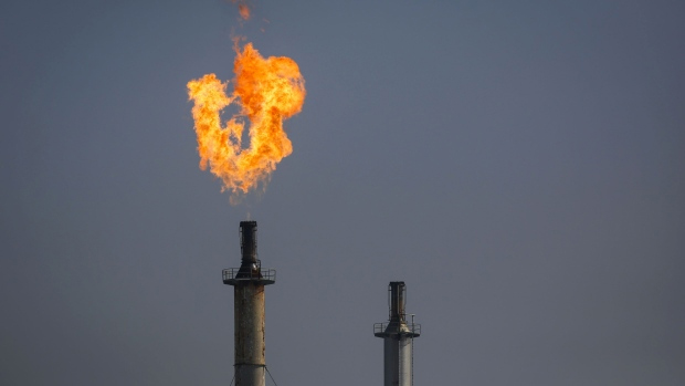 A flare burns over the Exxon Mobil Corp. Torrance refinery after an explosion and fire in Los Angeles, California, U.S., on Wednesday, Feb. 18, 2015.