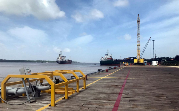 Vessels carrying supplies for an offshore oil platform operated by Exxon Mobil are seen at the Guyana Shore Base Inc wharf on the Demerara River, south of Georgetown, Guyana January 23, 2020. 