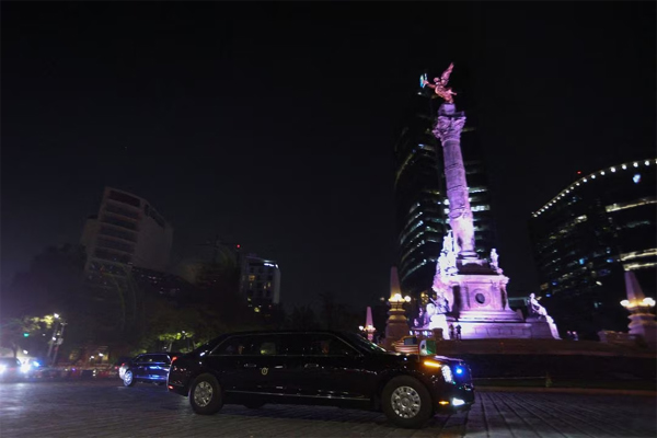 The motorcade of U.S. President Joe Biden passes in front of Angel of Independence monument as he arrives to attend the North American Leader's Summit in Mexico City, Mexico January 8,2023 