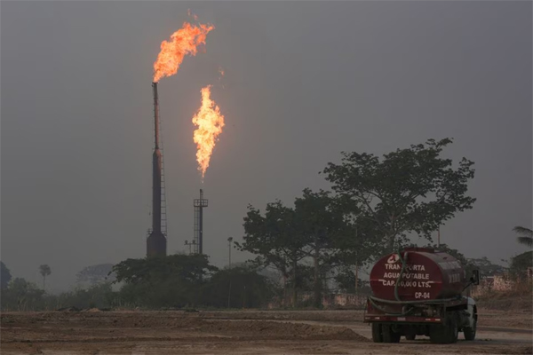 Gas is flared at the state energy company Petroleos Mexicanos (Pemex) Perdiz Plant, which is unable to process the vast volumes of gas sent from the Ixachi field, outside of Tierra Blanca, Mexico May 4, 2022. 