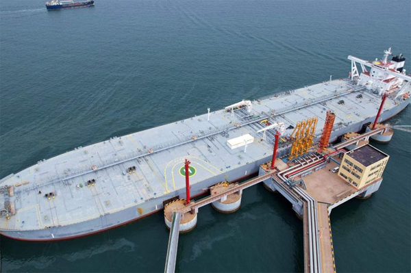 An oil tanker unloads imported crude oil at Qingdao port in China’s eastern Shandong province on May 9, 2022.