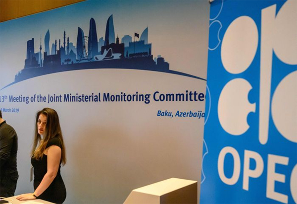 Staff members welcome delegates during the 13th meeting of the Joint Ministerial Monitoring Committee (JMMC) of OPEC and non- OPEC countries in Baku on March 18, 2019.