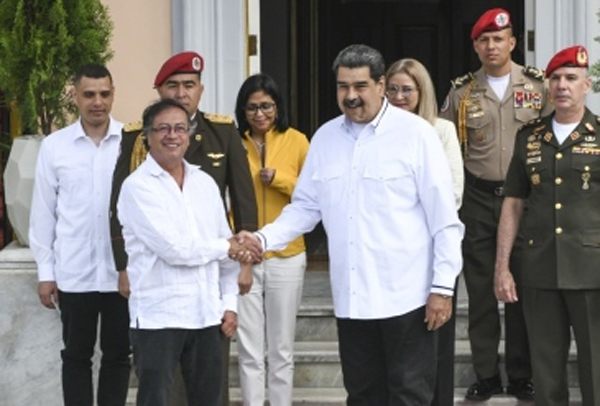 Presidents Nicolas Maduro, center right, and Gustavo Petro shake hands during a meeting at Miraflores Palace in Caracas, Venezuela, on Jan. 7.