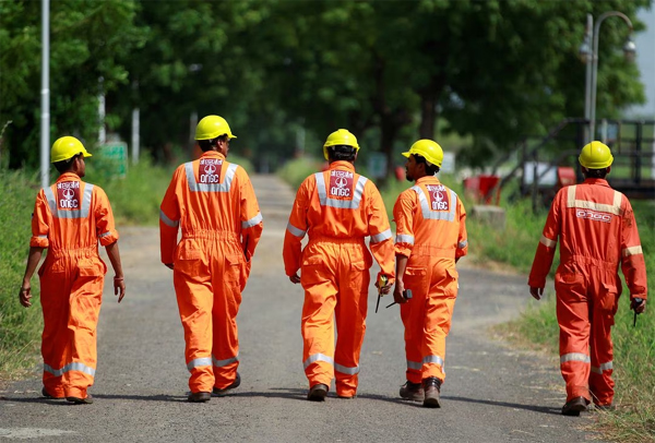 Technicians walk next inside a desalter plant of Oil and Natural Gas Corp (ONGC) on the outskirts of Ahmedabad, India, September 30, 2016.  