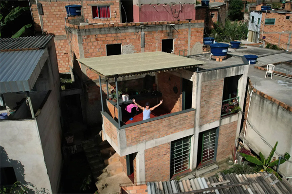An aerial view shows Kdu dos Anjos's house in Aglomerado da Serra, a favela complex on the outskirts of Belo Horizonte, Minas Gerais State, Brazil [Douglas Magno/AFP]