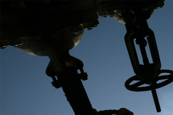 An oil worker at an oil refinery in Baghdad, Iraq.  