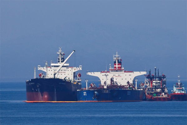 The Liberian-flagged oil tanker Ice Energy transfers crude oil from the Iranian-flagged oil tanker Lana (former Pegas), off the shore of Karystos, on the Island of Evia, Greece, May 26, 2022. 