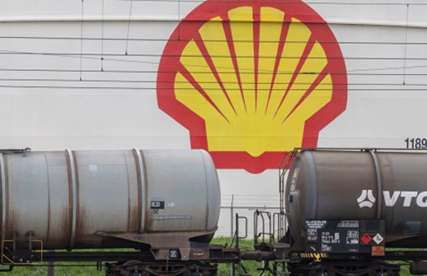 The logo of Shell Plc on a oil storage silo, beyond railway tanker wagons at the company's Pernis refinery in Rotterdam, Netherlands, on Sunday, Oct. 23, 2022. Shell reports earnings on Oct. 27. 