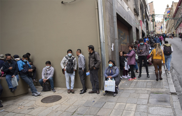 Residents wait in line outside of the Bolivian Central Bank in La Paz, Bolivia, on March 8. 