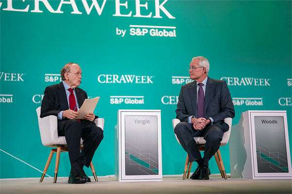 (Left to right) Daniel Yergin, vice chair of S&P Global, speaks with Exxon Mobil Corp. CEO Darren Woods on Tuesday at the CERAWeek by S&P Global conference in Houston. @CERAWeek/Twitter