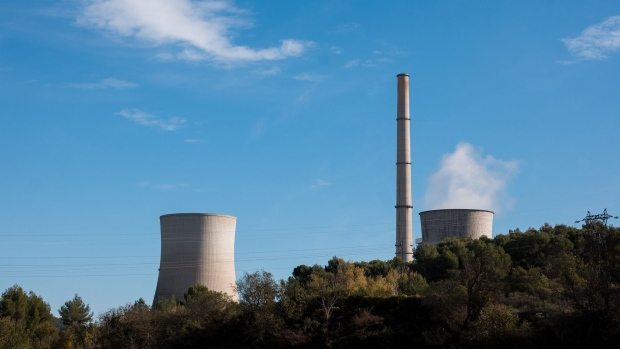 Vapor rises from a cooling tower at the coal-fired Provence Power Station, operated by Gazel Energie, in Gardanne, France, on Thursday, Nov. 24, 2022. To limit the damage to the economy and head off social unrest, France's President Emmanuel Macron's administration has earmarked at least 100 billion ($103 billion) to help consumers, businesses, and public authorities cope with rising prices for power, natural gas and gasoline through next year. 