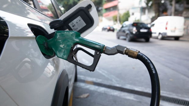 A vehicle refuels at a Petroleo Brasileiro SA (Petrobras) gas station in Rio de Janeiro, Brazil, on Friday, June 17, 2022. Brazil's state-controlled oil giant Petrobras increased fuel prices in a political setback for President Jair Bolsonaro, who is fighting to contain inflation in an election year.  