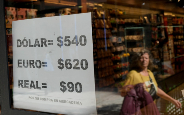 A shop displays on a sheet of paper unofficial currency exchange rates in Buenos Aires, Argentina, Wednesday, April 26, 2023. 