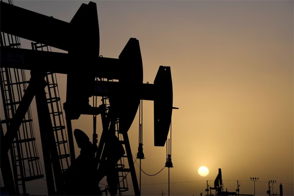 Pump jacks operate at sunset in Midland, Texas, U.S., February 11, 2019. 
