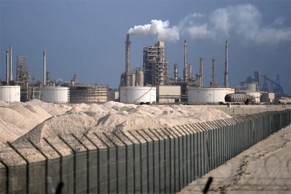A refinery in Doha, Qatar. The country is planning to unveil the world’s biggest gas production facility in 2025.Credit...Neil Hall/EPA, via Shutterstock
