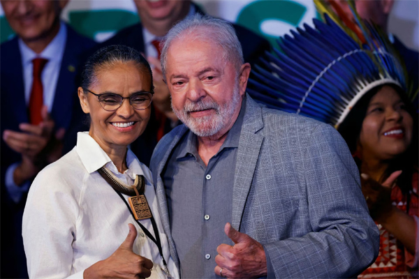 Marina Silva, nominee for environment minister, stands next to Brazilian President-elect Luiz Inacio Lula da Silva during the presentation of the ministers nominated for his government at the transition government building in Brasilia, Brazil December 29, 2022. REUTERS/Adriano Machado