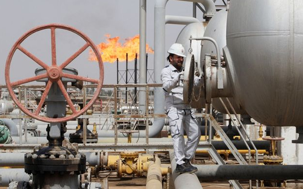 A worker checks a tank at an oil field in Iraq.( Essam Al sudani / Reuters)