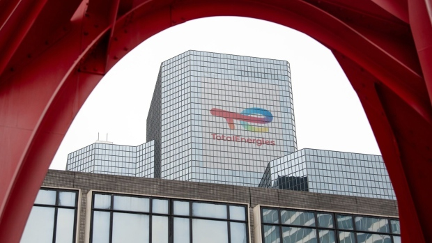 Signage for TotalEnergies SE at the company's headquarters in the La Defense business district in Paris, France, on Friday, Oct. 14, 2022. TotalEnergies called for all strikes to end as two unions, which together represent a majority of workers, agreed to an offer of a 7% increase in 2023, the CGT union rejected the deal demanding a 10% raise.  