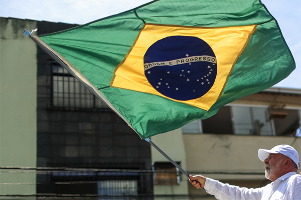 Luiz Inacio Lula da Silva waves a Brazilian flag in Sao Gonçalo, Brazil.  