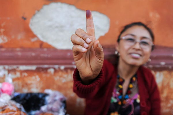 A woman shows her ink-stained finger during the first round of Guatemala's presidential election in Guatemala City, Guatemala, June 25, 2023.  