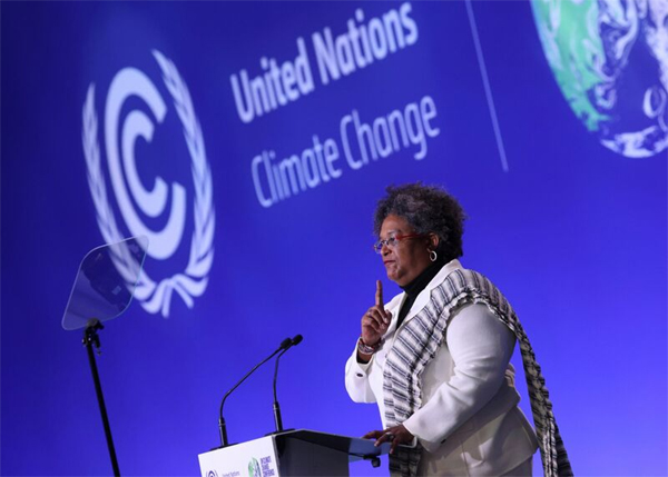 Mia Mottley delivers a speech at COP26 in Glasgow on Nov. 2021. 