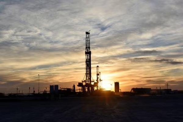 Drilling rigs operate at sunset in Midland, Texas, U.S., February 13, 2019. Picture taken February 13, 2019.  