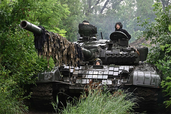 Ukrainian servicemen in a T-72 tank in the Donetsk region on June 25 