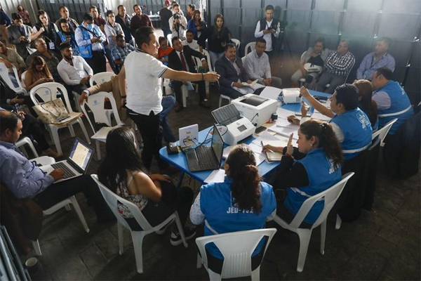 Officials review voting records at the Electoral Process Operations Center in Guatemala City, July 5.