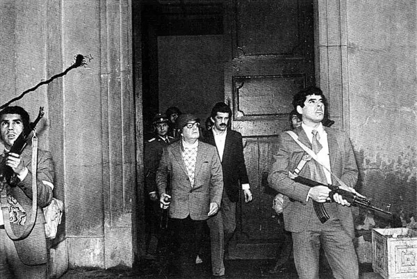 President Salvador Allende, center, with bodyguards. (Reuters)