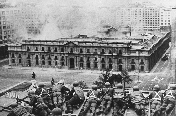 Chilean Army troops firing on the La Moneda Palace in Santiago on Sept. 11, 1973, during a coup led by Gen. Augusto Pinochet against President Salvador Allende.Credit...Agence France-Presse — Getty Images