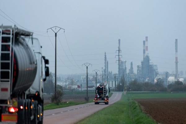 Tanker trucks travel towards the TotalEnergies SE Grandpuits oil refinery in Grandpuits-Bailly-Carrois, France, on Thursday, Dec. 1, 2022. France was among several European nations to slap windfall taxes on oil companies after Russia’s invasion of Ukraine drove up energy prices.  European Union states are coalescing around a plan to cap the price of Russian crude oil at $60 a barrel, their latest attempt to clinch an agreement before a Monday deadline, according to people familiar with the matter. (Benjamin Girette/Bloomberg )