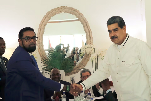 enezuela's President Nicolas Maduro and Guyanese President Irfaan Ali shake hands as they meet amid tensions over a border dispute, in Kingstown, St. Vincent and the Grenadines December 14, 2023. Miraflores Palace/Handout via REUTERS