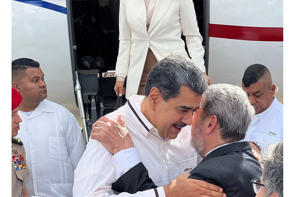 President of Venezuela Nicolas Maduro is greeted by St Vincent Prime Minister Dr Ralph Gonsalves at the Argyle International Airport. (Photo via NBC Radio St Vincent and the Grenadines).