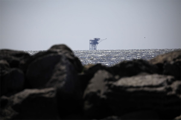 Interior required to hold auction by Congress in climate law. Gulf lease sales set to go on two-year hiatus under Biden plan.An offshore oil well platform in the Gulf of Mexico off Grand Isle, Louisiana, in 2021.(Luke Sharrett/Bloomberg)