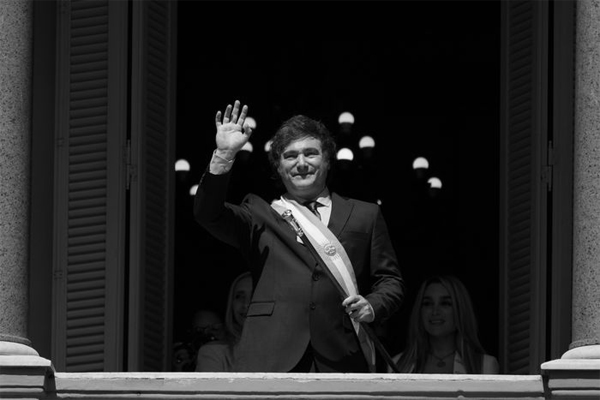 Argentina's newly sworn-in President Javier Milei waves to supporters in Buenos Aires, Dec. 10, 2023. (Matilde Campodonico/AP)