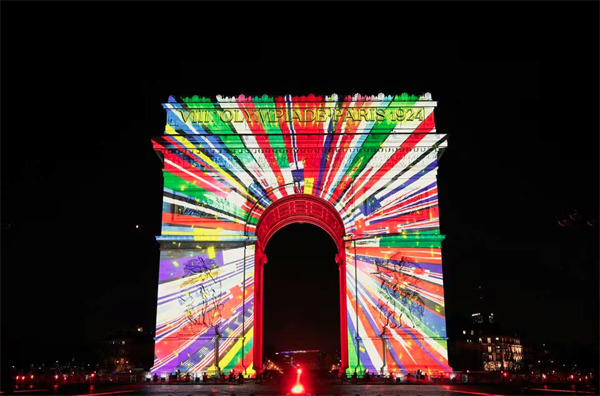 An image is projected onto the Arc de Triomphe to celebrate the entry into the Olympic year, during the New Year's celebrations on the Champs Elysees avenue in Paris, France, December 31, 2023. REUTERS/Benoit Tessier 