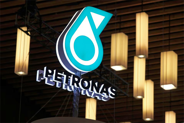 The logo of Malaysian energy group National Petroleum Limited, commonly known as PETRONAS, is displayed at their booth during the LNG 2023 energy trade show in Vancouver, British Columbia, Canada, July 12, 2023. REUTERS/Chris Helgren