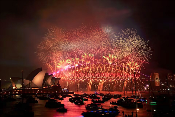 Fireworks are seen over the Sydney Opera House and Harbour Bridge during New Year's Eve celebrations in Sydney, Australia. (Dan Himbrechts/ AAP