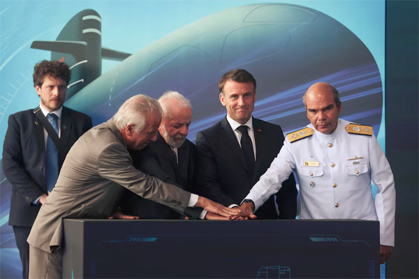 Macron and Lula launch submarine built in Brazil with French tech. People stand during the launching of the third Scorpene-class diesel-powered submarine built in Brazil with French technology, at the Itaguai shipyard in Rio de Janeiro state, Brazil March 27, 2024. Reuters/Pilar Olivares 