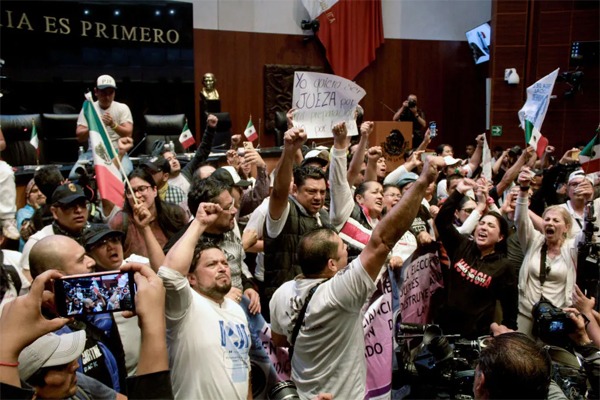 Protesters storm Mexico’s Senate to protest judicial reform, in Mexico City on Sept. 10, 2024.Santiago Reyes—ObturadorMX/Getty Images