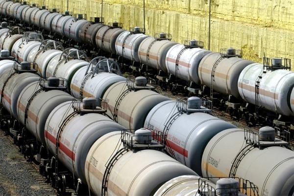 Tank wagons stand in line next to sulphur stored at Tengiz oil and gas refinery plant in western Kazakhstan. REUTERS/Shamil Zhumatov