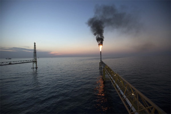 Gas flares from a tower on a Petroleos Mexicanos offshore from Ciudad del Carmen, Mexico.Photographer: Susana Gonzalez/Bloomberg